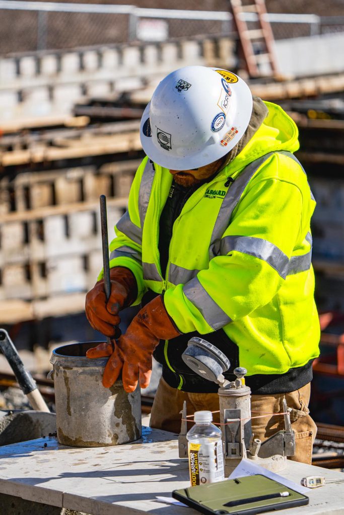 S.W. Cole team member performing concrete tests at a project site.