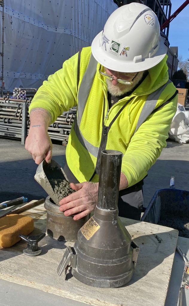 S.W. Cole team member performing concrete tests at a project site.