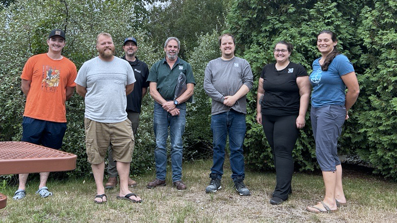 Group photo of S. W. Cole team members at a 45th anniversary event.