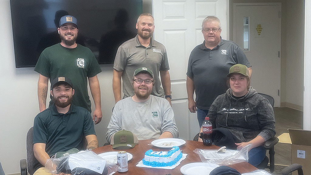 Group photo of S. W. Cole team members at a 45th anniversary event.