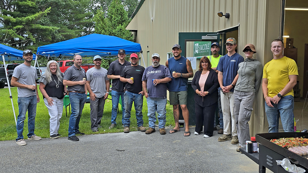 Group photo of S. W. Cole team members at a 45th anniversary event.