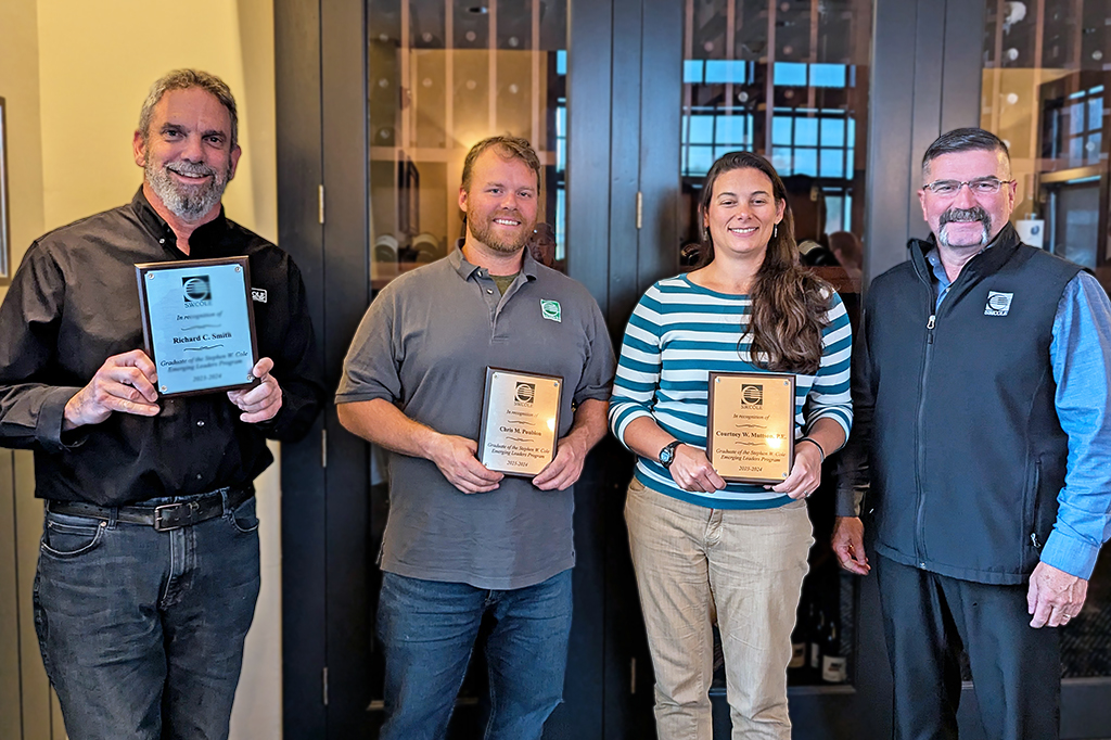 Emerging Leaders program participants, Richard Smith, Chris Poublon and Courtney Mattson with CEO Bob Chaput.