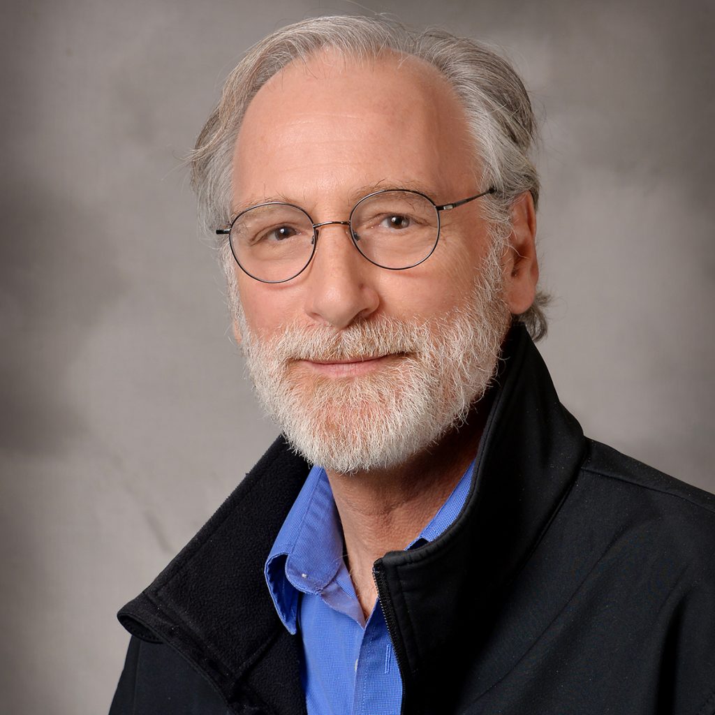 Professional headshot photo of Tom McIntosh