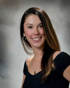 Professional headshot photo of Emma Dennis